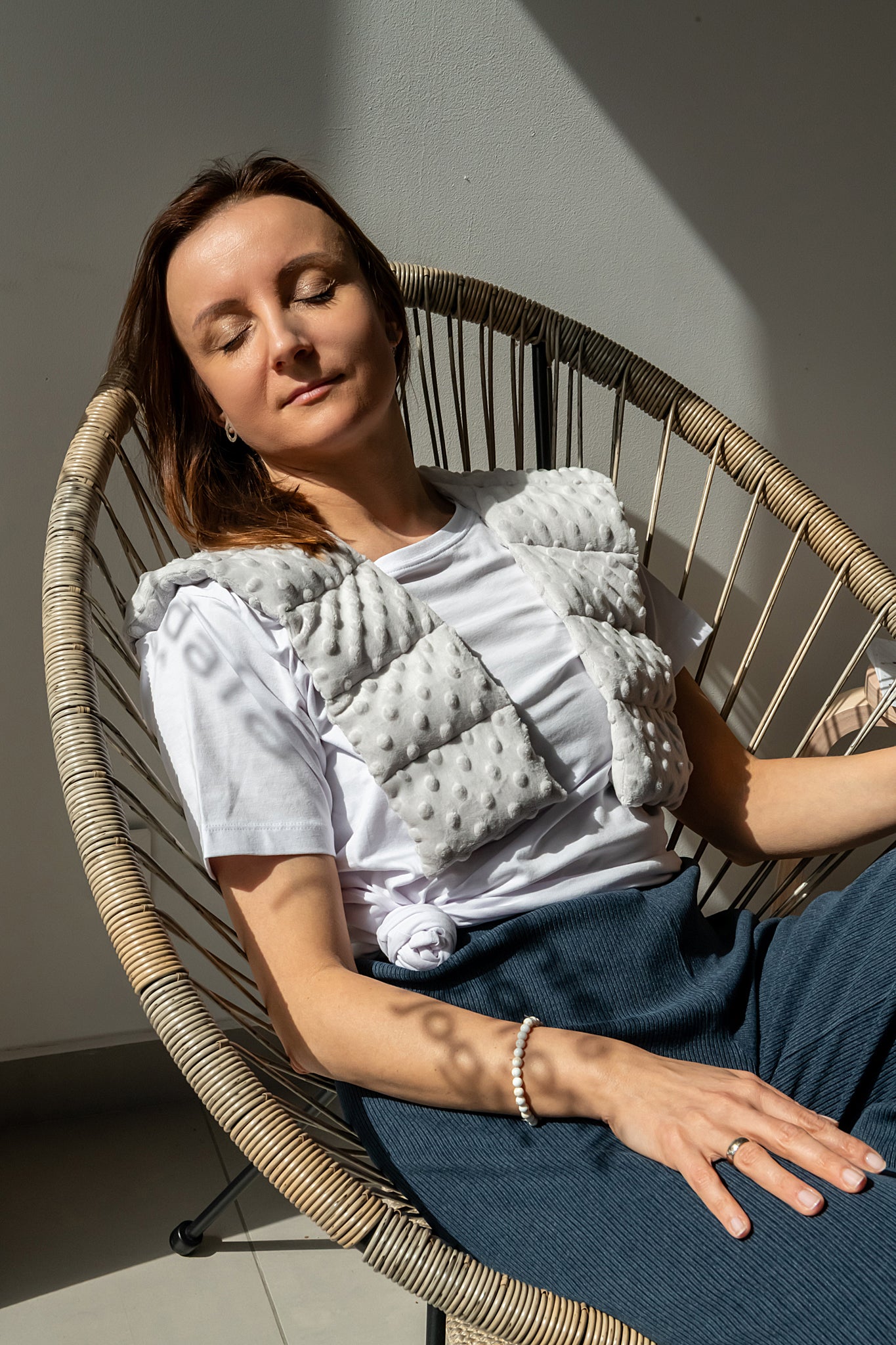 woman wearing long minky weighted collar  in light grey shade made by sensory owl