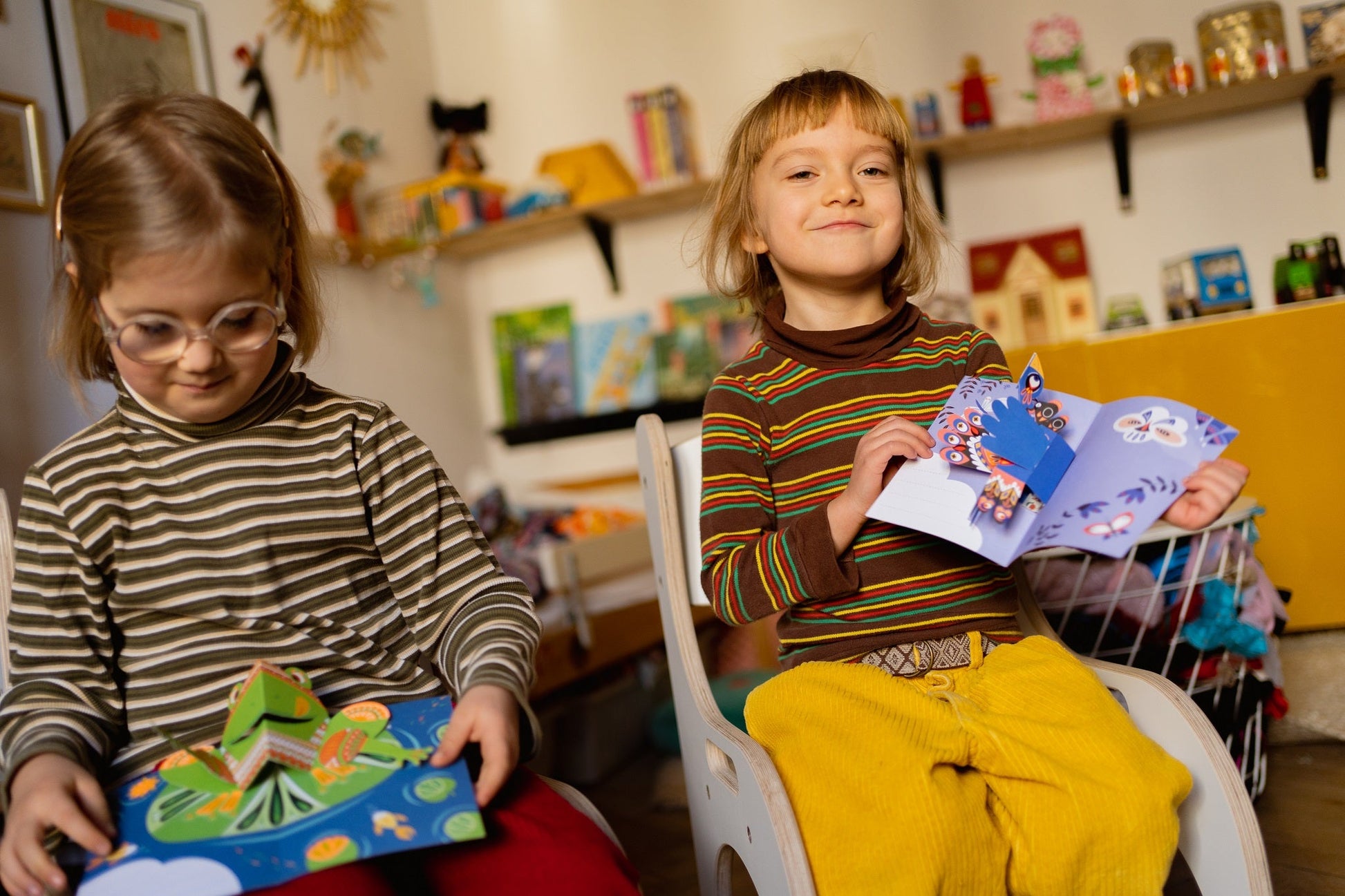CHILDREN SITTING ON GOOD WOOD CHAIRS