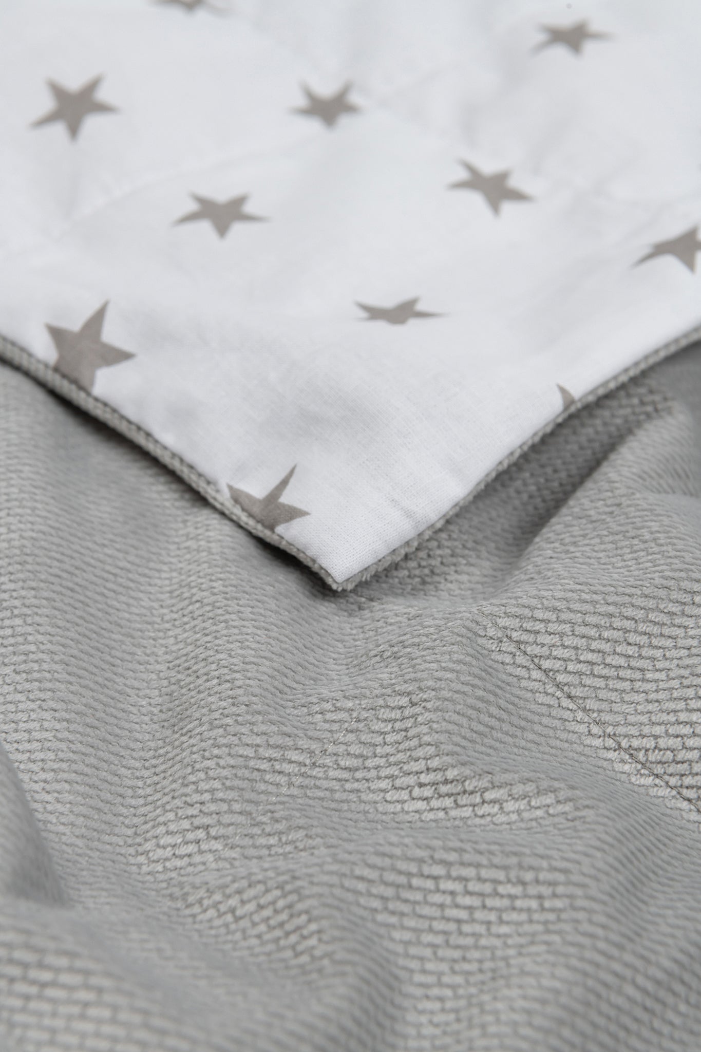 GREY STARS WEIGHTED BLANKET close up to the ash velvet backing