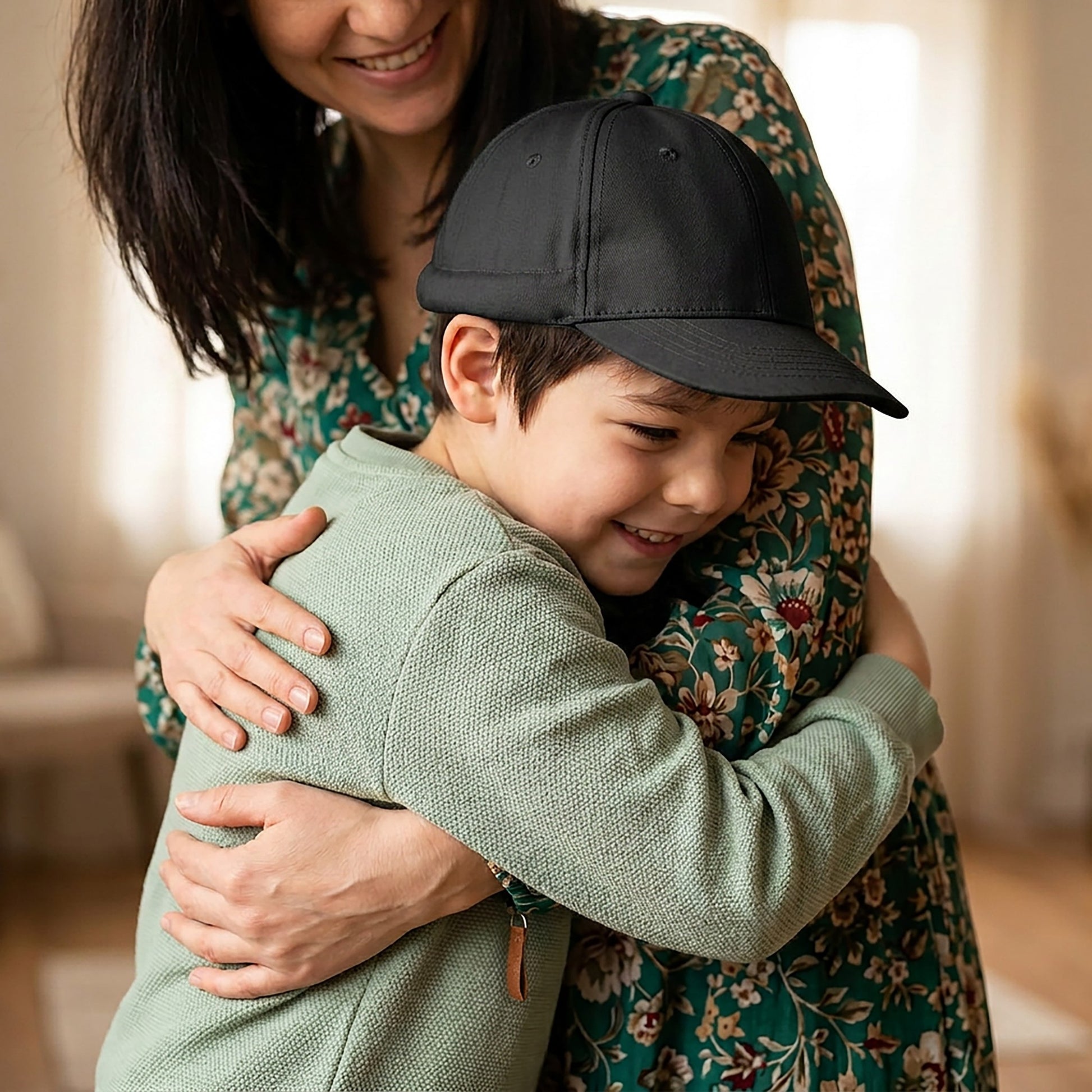 Side profile of a child wearing the black weighted Calm Cap sensory baseball hat