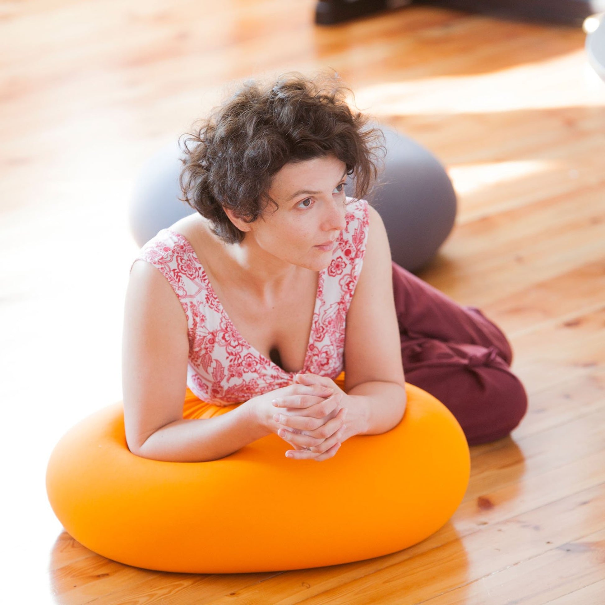 women leaning over livingbag in tumeric colour